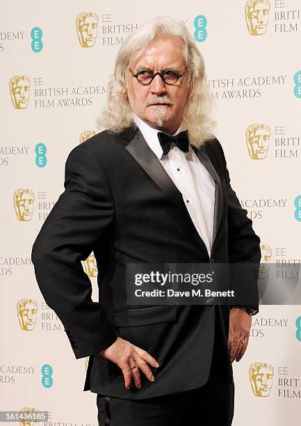 Presenter Billy Connolly poses in the Press Room at the EE British Academy Film Awards at The Royal Opera House on February 10, 2013 in London,...