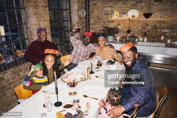 british family celebrating christmas in loft apartment - camera flash stock pictures, royalty-free photos & images