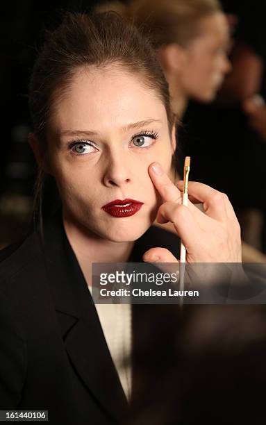 Model Coco Rocha prepares backstage at the Zac Posen Fall 2013 fashion show during Mercedes-Benz Fashion Week on February 10, 2013 in New York City.