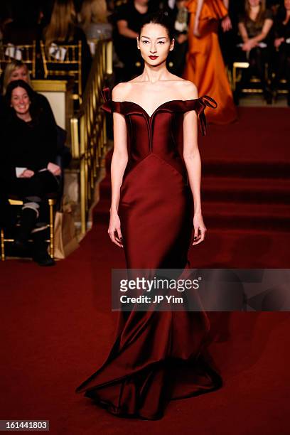 Model walks the runway at the Zac Posen Fall 2013 fashion show during Mercedes-Benz Fashion Week at The Plaza Hotel on February 10, 2013 in New York...