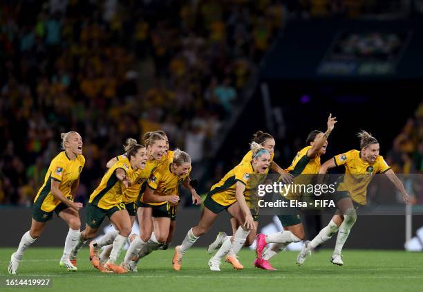 Players of Australia celebrate their side's victory in the penalty shoot out after Cortnee Vine of Australia scores her team's tenth penalty in the...