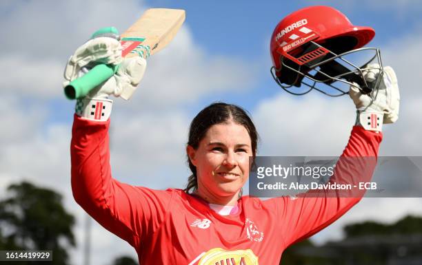 Tammy Beaumont of Welsh Fire Women interacts with the crowd as they make their way off after being dismissed for 118 during The Hundred match between...