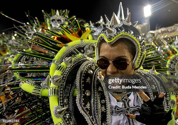 Dancers of Mocidade Independente de Padre Miguel Samba School perform during the fifth parade of the day at 2013 Brazilian Carnival at Sapucaí...