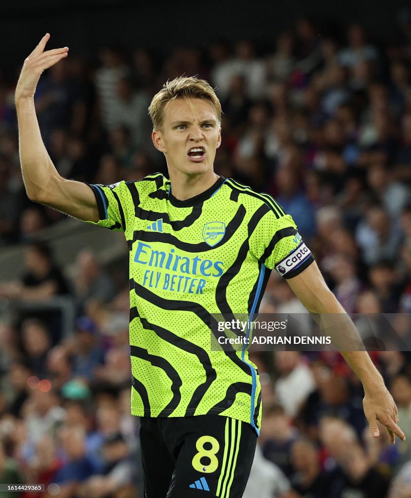 Arsenal's Norwegian midfielder Martin Odegaard celebrates scoring