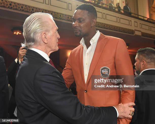 Pat Riley & Chris Bosh embrace during the 2023 Basketball Hall of Fame Enshrinement Ceremony on August 12, 2023 at Springfield Marriott in...