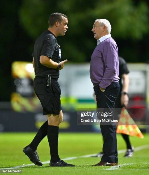 Dublin , Ireland - 21 August 2023; Galway United manager John Caulfield in conversation with referee Robert Harvey during the Sports Direct Men's FAI...