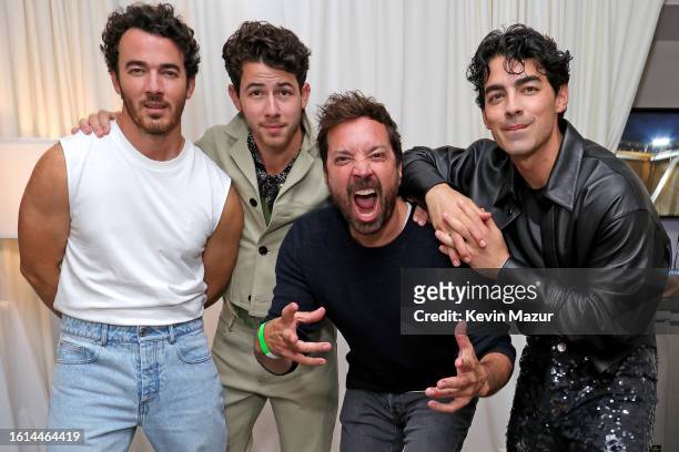 Kevin Jonas, Nick Jonas, Jimmy Fallon, and Joe Jonas pose backstage during Jonas Brothers “Five Albums, One Night” Tour - New York at Yankee Stadium...