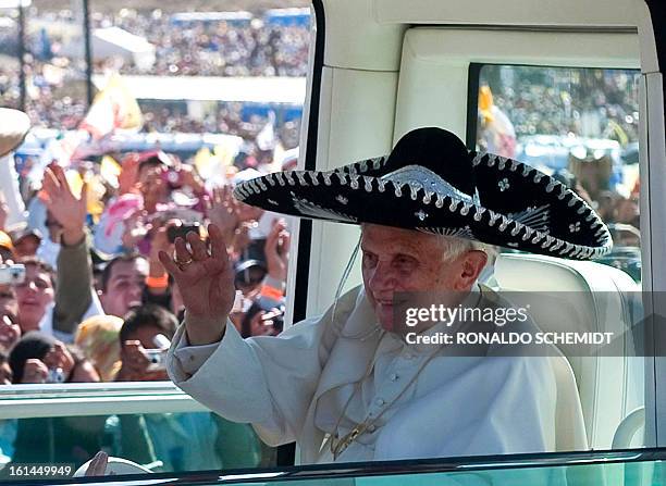 Wearing a large brim typical Mexican hat, Pope Benedict XVI arrives at Bicentennial Park in his Popemobile in Silao, Guanajuato State, Mexico, where...