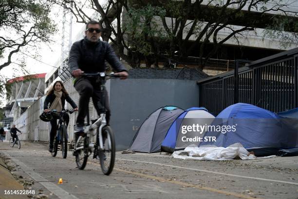 Fans of US superstar Taylor Swift camp 250 metres away from the main entrance of River Plate's Mas Monumental stadium in Buenos Aires on August 21...