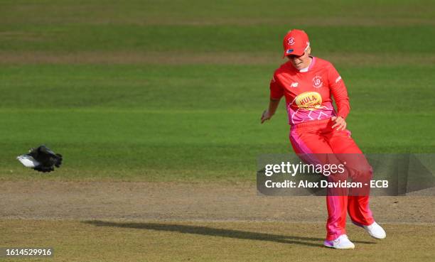 Alex Hartley of Welsh Fire Women chases away a pigeon from the square during The Hundred match between Welsh Fire Women and Trent Rockets Women at...