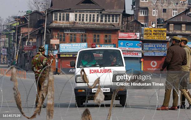 Policemen stop a Ambulance vehicle on the 3rd day of curfew on February 11, 2013 in Srinagar, India. Kashmir Valley remained under curfew for the...