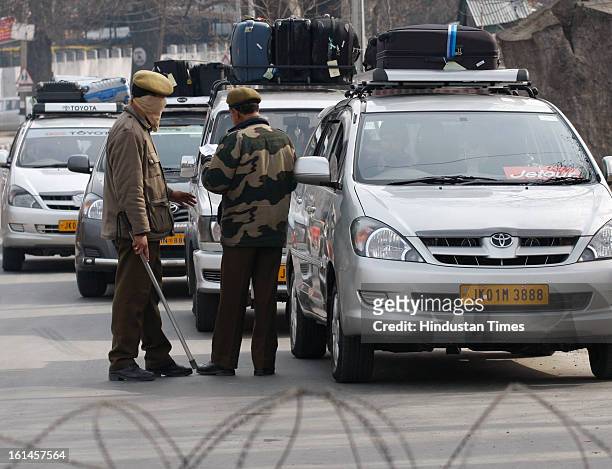 Tourist vehilcles being cheked by police while leaving Srinagar on the 3rd day of curfew on February 11, 2013 in Srinagar, India. Kashmir Valley...