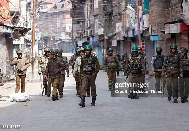 Paramilatary soldiers and policemen patroling the street on the 3rd day of curfew on February 11, 2013 in Srinagar, India. Kashmir Valley remained...