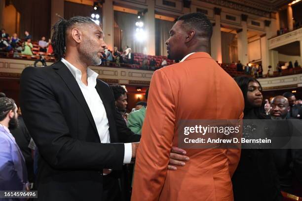 Tim Duncan & Chris Bosh look on during the 2023 Basketball Hall of Fame Enshrinement Ceremony on August 12, 2023 at Springfield Marriott in...