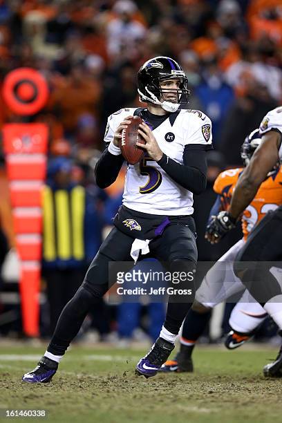 Joe Flacco of the Baltimore Ravens throws a pass against the Denver Broncos during the AFC Divisional Playoff Game at Sports Authority Field at Mile...