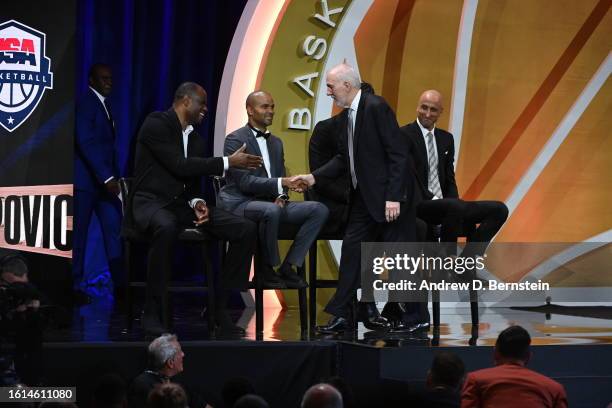 Gregg Popovich, David Robinson, Tony Parker, Tim Duncan,& Manu Ginóbili embrace during the 2023 Basketball Hall of Fame Enshrinement Ceremony on...