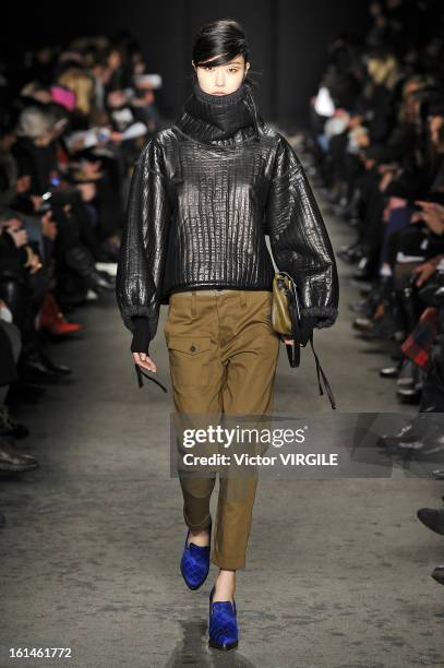 Model walks the runway at the Rag & Bone Women's Ready to Wear Fall/Winter 2013-2014 fashion show during Mercedes-Benz Fashion Week at Skylight...