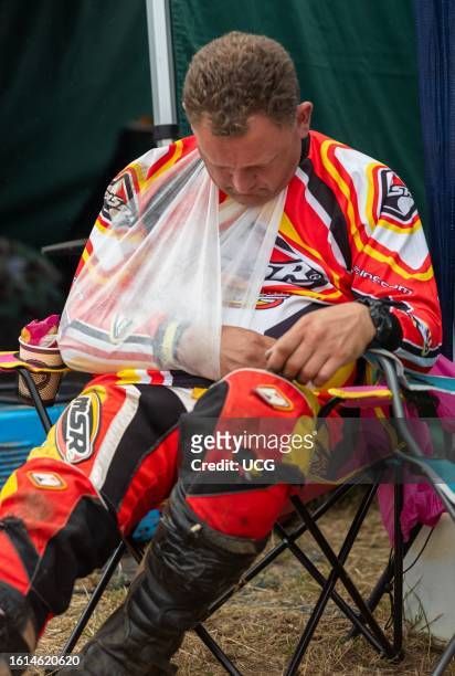 Racing lawn mower driver who broke his collar bone in an accident sleeps at sunrise next to the track at the BLMRA 500, a Le Mans style 500 mile...