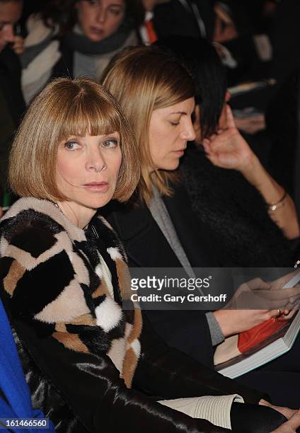 Editor-in-chief, Vogue magazine, Anna Wintour and creative director, Vogue magazine, Virginia Smith attend the Carolina Herrera fashion show during...