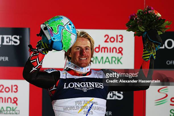 Ted Ligety of the United States of America celebrates at the flower ceremony after winning the Men's Super Combined during the Alpine FIS Ski World...