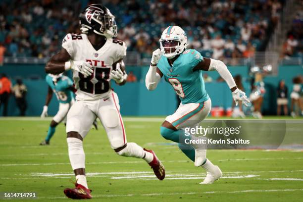 Noah Igbinoghene of the Miami Dolphins covers Frank Darby of the Atlanta Falcons during an NFL preseason game at Hard Rock Stadium on August 21, 2021...