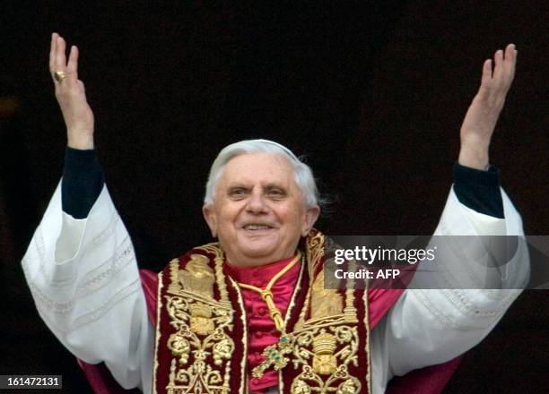 Germany's Joseph Ratzinger, the new Pope Benedict XVI, waves to crowd from the window of St Peter's Basilica's main balcony after being elected the...