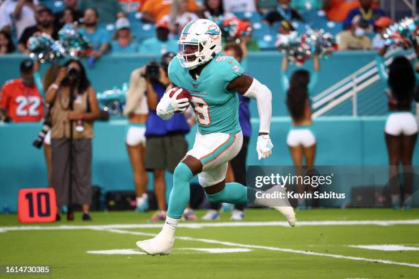 Noah Igbinoghene of the Miami Dolphins returns a kickoff during an NFL preseason game against the Atlanta Falcons at Hard Rock Stadium on August 21,...