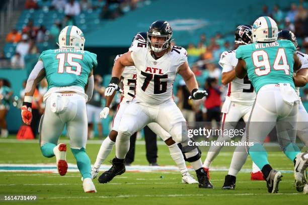 Kaleb McGary of the Atlanta Falcons blocks during an NFL preseason game against the Miami Dolphins at Hard Rock Stadium on August 21, 2021 in Miami...