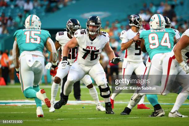 Kaleb McGary of the Atlanta Falcons blocks during an NFL preseason game against the Miami Dolphins at Hard Rock Stadium on August 21, 2021 in Miami...