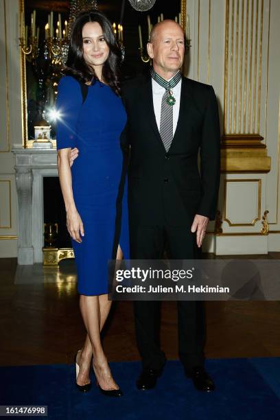 Bruce Willis poses with his wife Emma Heming-Willis after being awarded Commandeur dans l'Ordre des Arts et Lettres at Ministere de la Culture on...
