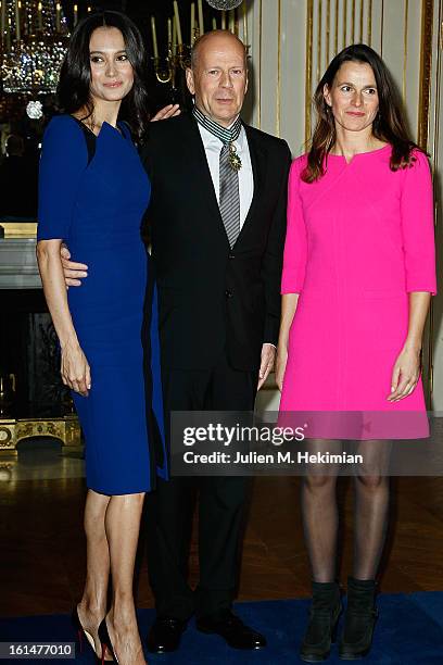 Bruce Willis poses with his wife Emma Heming-Willis after being awarded Commandeur dans l'Ordre des Arts et Lettres by French Minister for culture...