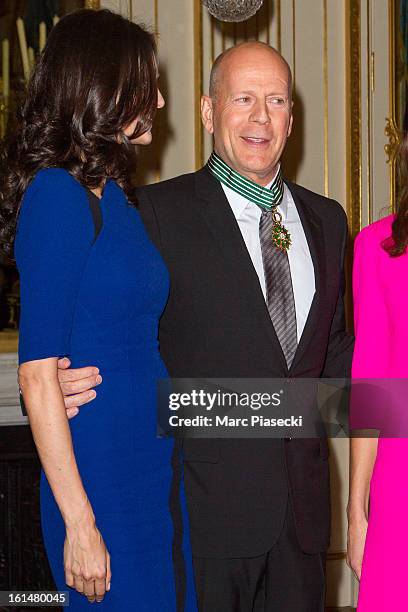 Bruce Willis poses with his wife Emma Heming-Willis after being awarded 'Commandeur dans l'Ordre des Arts et Lettres' at Ministere de la Culture on...