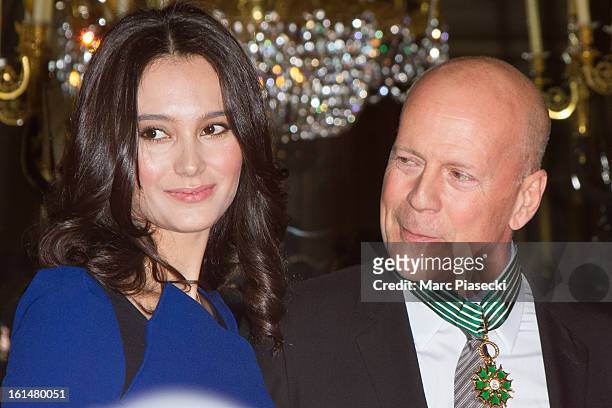 Bruce Willis poses with his wife Emma Heming-Willis after being awarded 'Commandeur dans l'Ordre des Arts et Lettres' at Ministere de la Culture on...