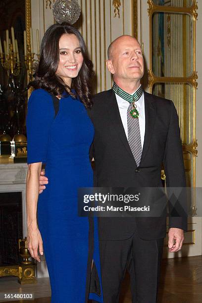 Bruce Willis poses with his wife Emma Heming-Willis after being awarded 'Commandeur dans l'Ordre des Arts et Lettres' at Ministere de la Culture on...