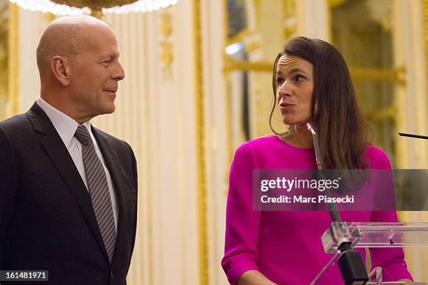 Bruce Willis attends the 'Commandeur dans l'Ordre des Arts et Lettres' medal ceremony with French Minister of Culture Aurelie Filipetti at Ministere...