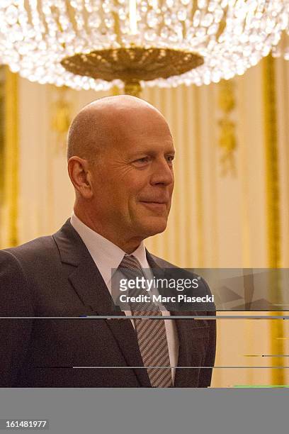 Bruce Willis attends the 'Commandeur dans l'Ordre des Arts et Lettres' medal ceremony at Ministere de la Culture on February 11, 2013 in Paris,...