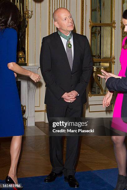 Bruce Willis attends the 'Commandeur dans l'Ordre des Arts et Lettres' medal ceremony at Ministere de la Culture on February 11, 2013 in Paris,...