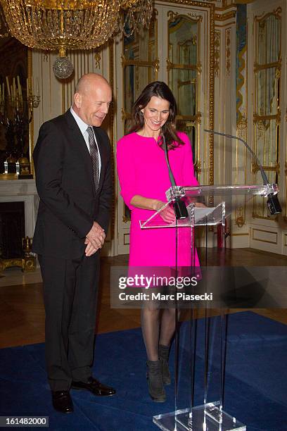 Bruce Willis receives the 'Commandeur dans l'Ordre des Arts et Lettres' medal from french minister of Culture Aurelie Filipetti at Ministere de la...