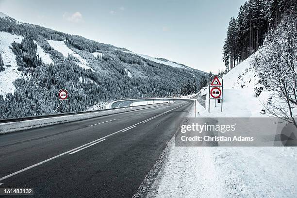 snowy road with a hairpin bend, at dusk - hair pin stock pictures, royalty-free photos & images