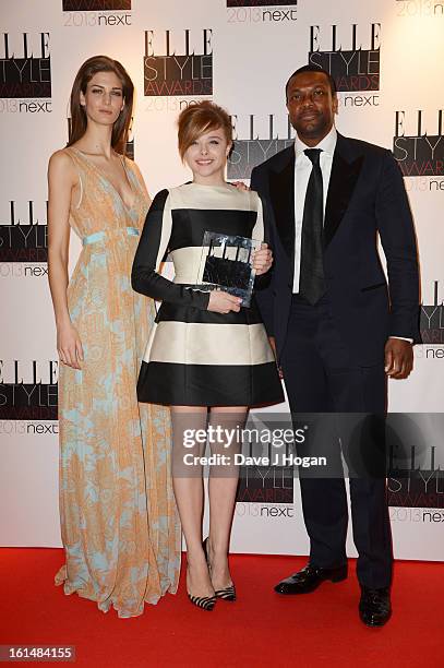 Chris Tucker and Kendra Spears pose with Chloe Moretz after presenting her with the Next Future Icon Award in the press room at The Elle Style Awards...