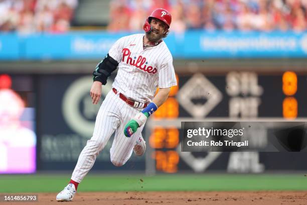 Bryce Harper of the Philadelphia Phillies advances to second, then third in the first inning during the game between the San Francisco Giants and the...