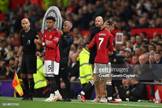 Jadon Sancho of Manchester United is substituted on as Mason Mount of Manchester United comes off during the Premier League match between Manchester...