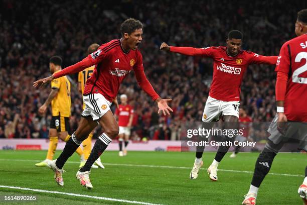 Raphael Varane of Manchester United celebrates after scoring the team's first goal during the Premier League match between Manchester United and...