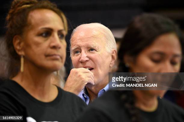 President Joe Biden gestures as he listens to a speaker during a community engagement event at the Lahaina Civic Center in Lahaina, Hawaii on August...