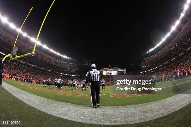 Head linesman Julian Mapp stands at the back of the endzone as the Denver Broncos line up against the Baltimore Ravens during the AFC Divisional...