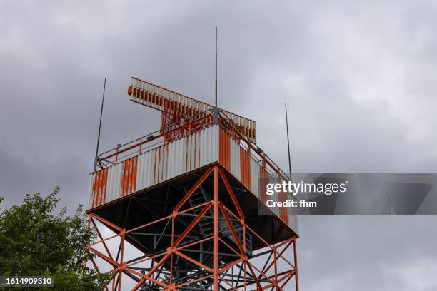 radar tower next to an airport - airborne weather radar stock pictures, royalty-free photos & images