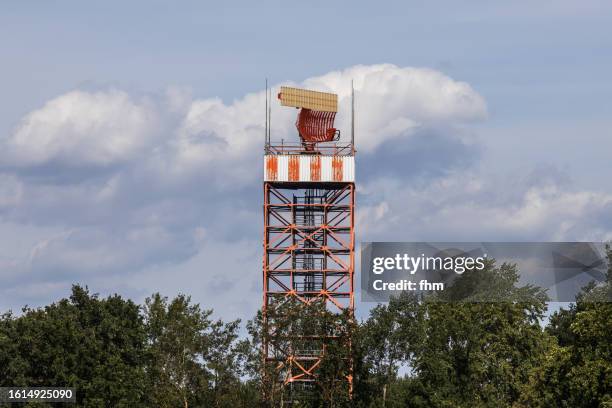radar tower next to an airport - airborne weather radar stock pictures, royalty-free photos & images