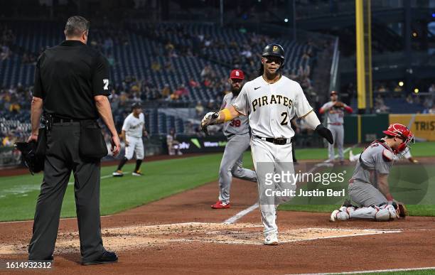 Connor Joe of the Pittsburgh Pirates comes around to score on a two run RBI single by Liover Peguero in the third inning during the game against the...
