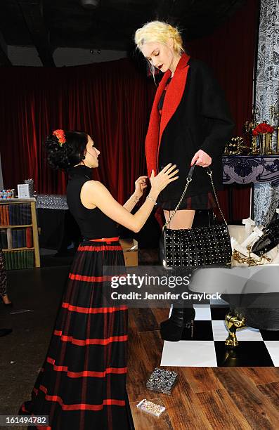 Designer Stacey Bendet prepares a model at the Alice + Olivia By Stacey Bendet Fall 2013 fashion show presentation during Mercedes-Benz Fashion Week...