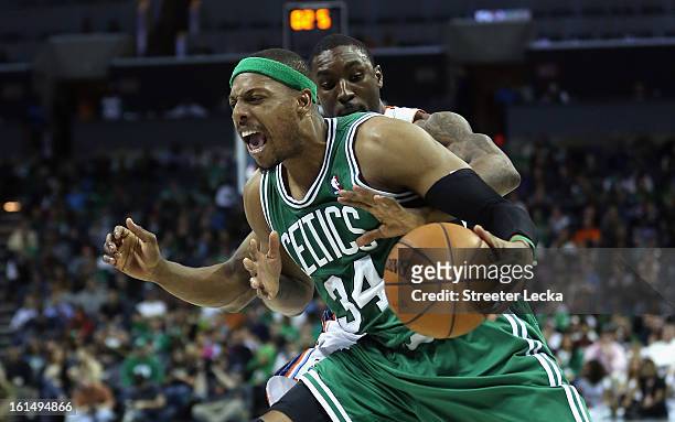 Ben Gordon of the Charlotte Bobcats reaches in for the ball against Paul Pierce of the Boston Celtics during their game at Time Warner Cable Arena on...